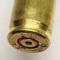 The back end of bullet casing of a 5.56 x 45mm NATO cartridge