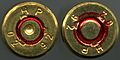 The back of a fired (left) and not fired (right) 5.56 x 45mm NATO cartridge