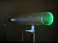 A Crookes tube with a standing cross in use